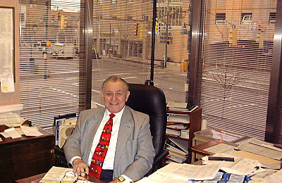 George Schultz in his office
