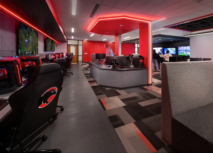 Sewickley Academy Esports Suite showing interior with red lights and gaming stations